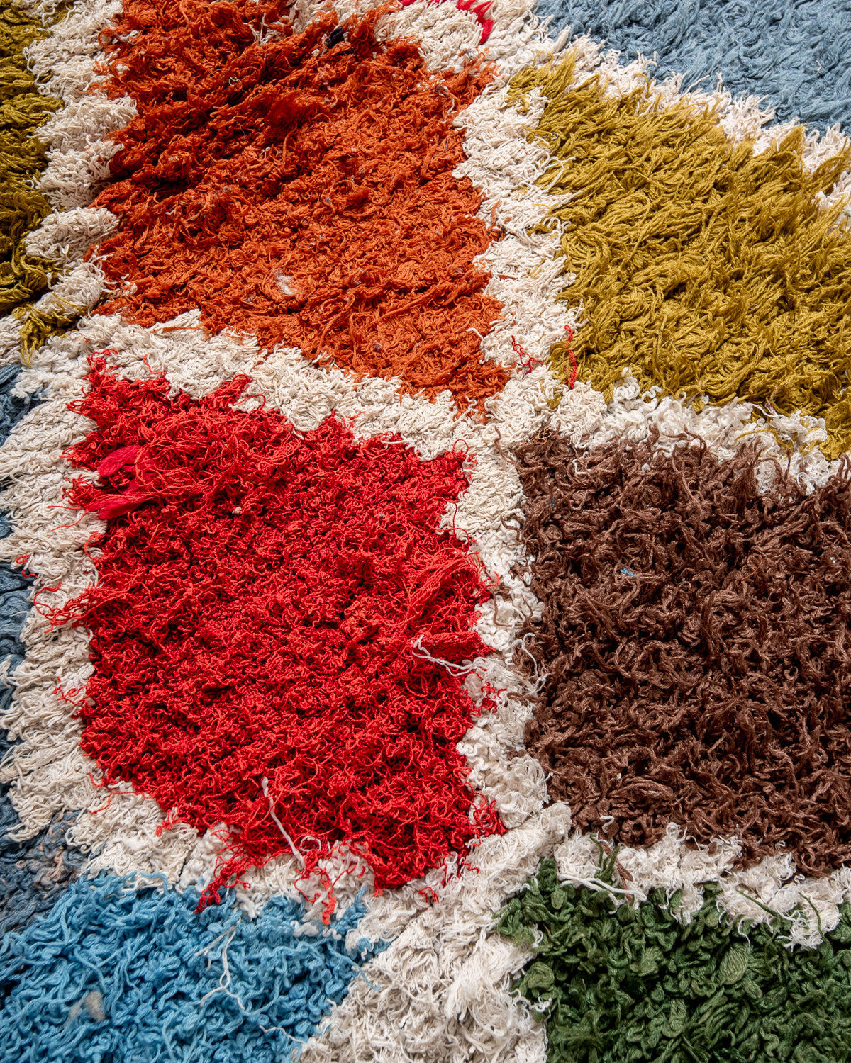 Modern designer vintage handcrafted Berber rug from Morocco. Boucherouite runner rug with beautiful colors and patterns.